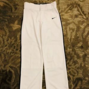 Boys Nike Dri fit youth large baseball pants white with a navy stripe.New.